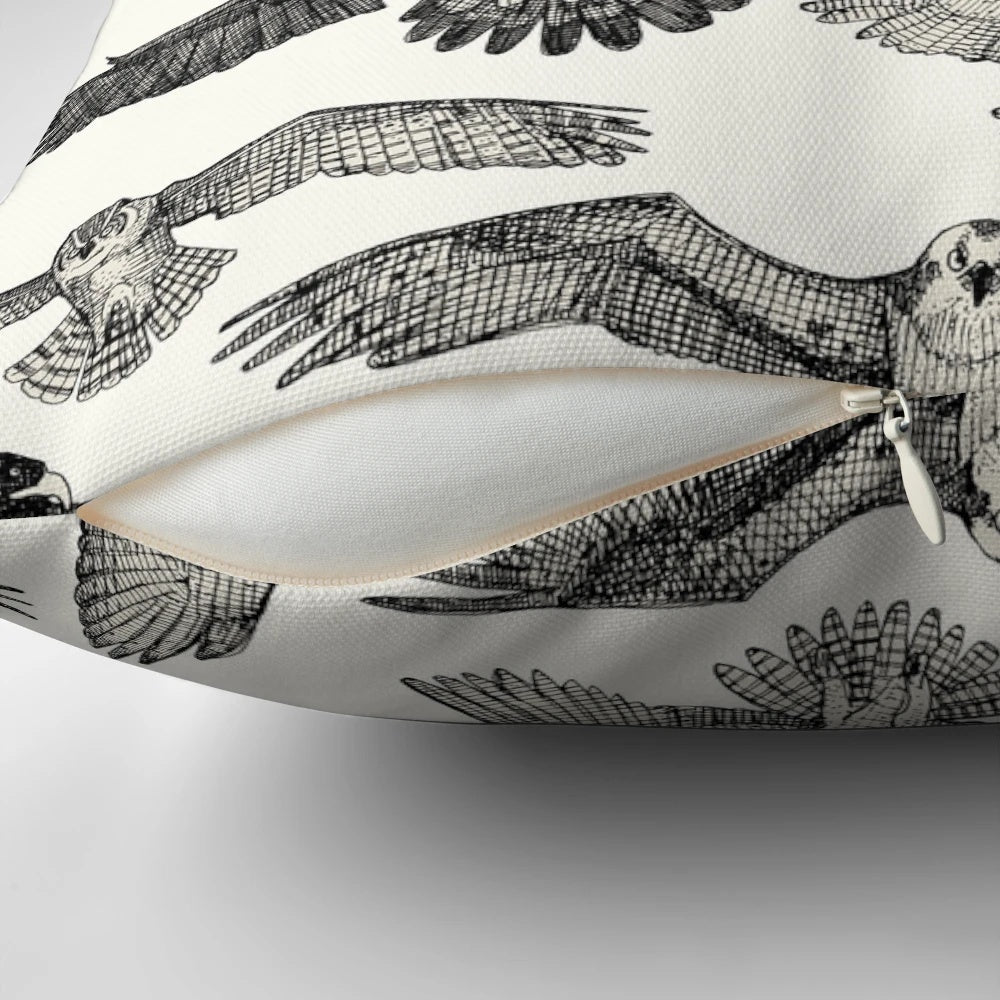 A stylish black throw pillow featuring a stunning pattern of birds of prey like owls, hawks, and eagles.