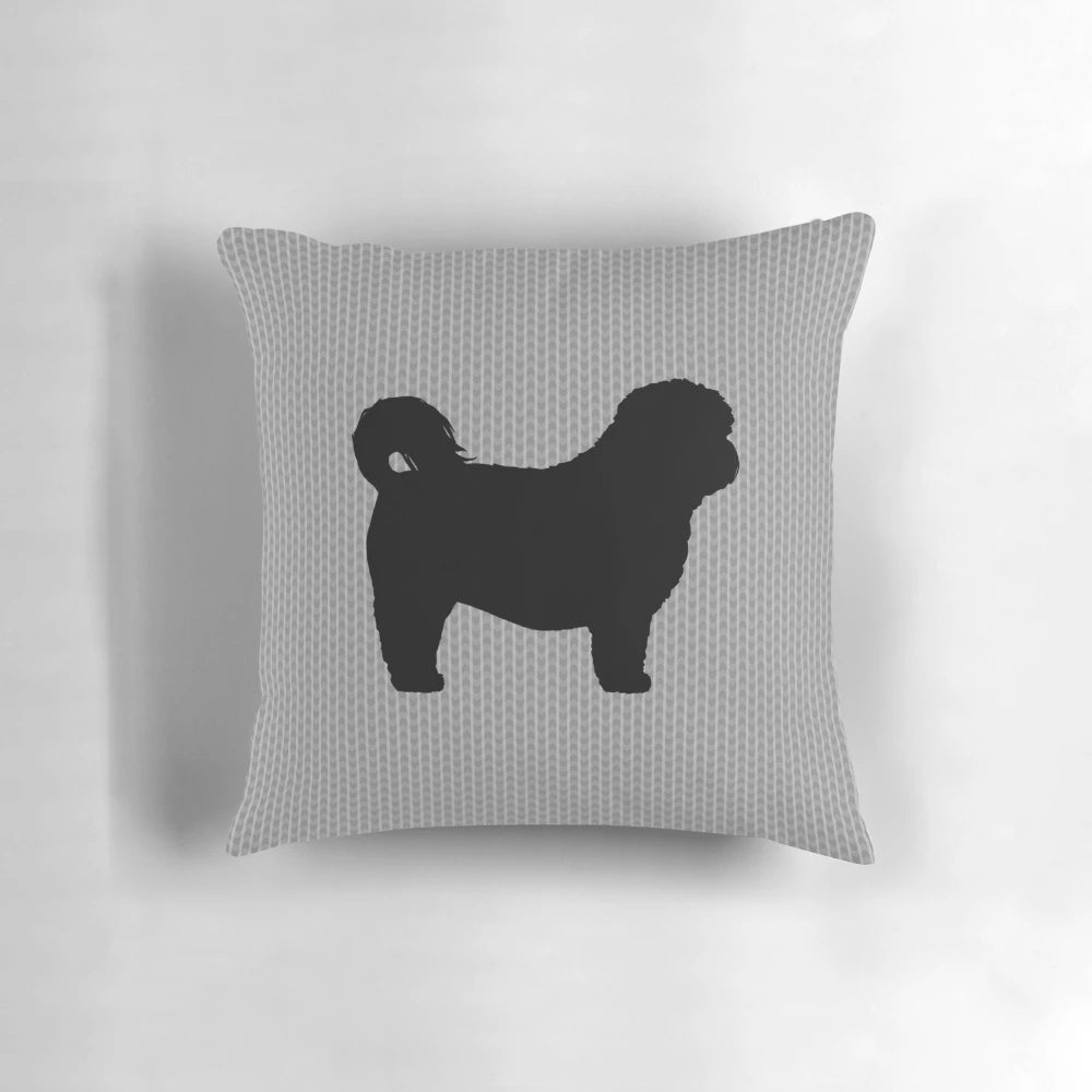 Black and white silhouette of a Shih Tzu dog printed on a decorative pillow.