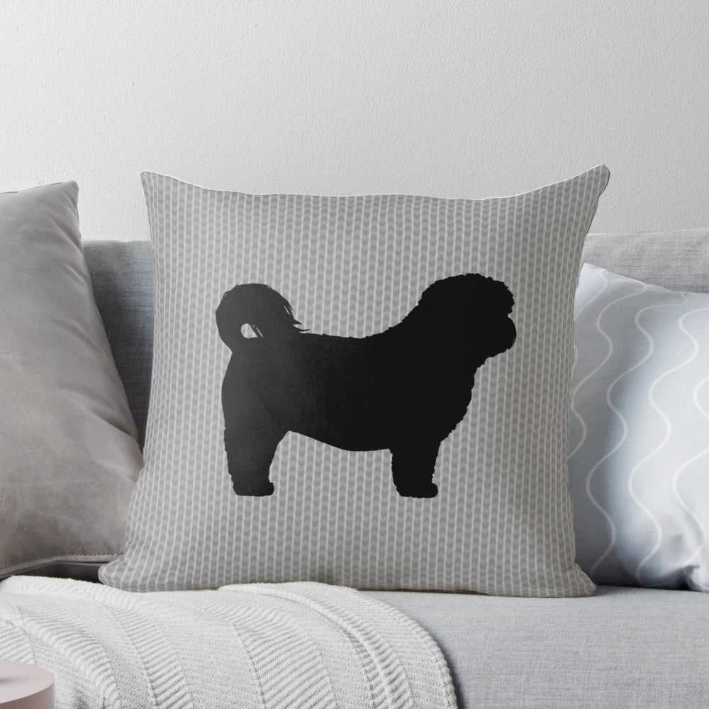 Black and white silhouette of a Shih Tzu dog printed on a decorative pillow.