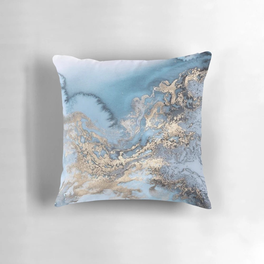 Blue and gold marble decorative pillow with a modern, chic design