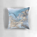 Blue and gold marble decorative pillow with a modern, chic design