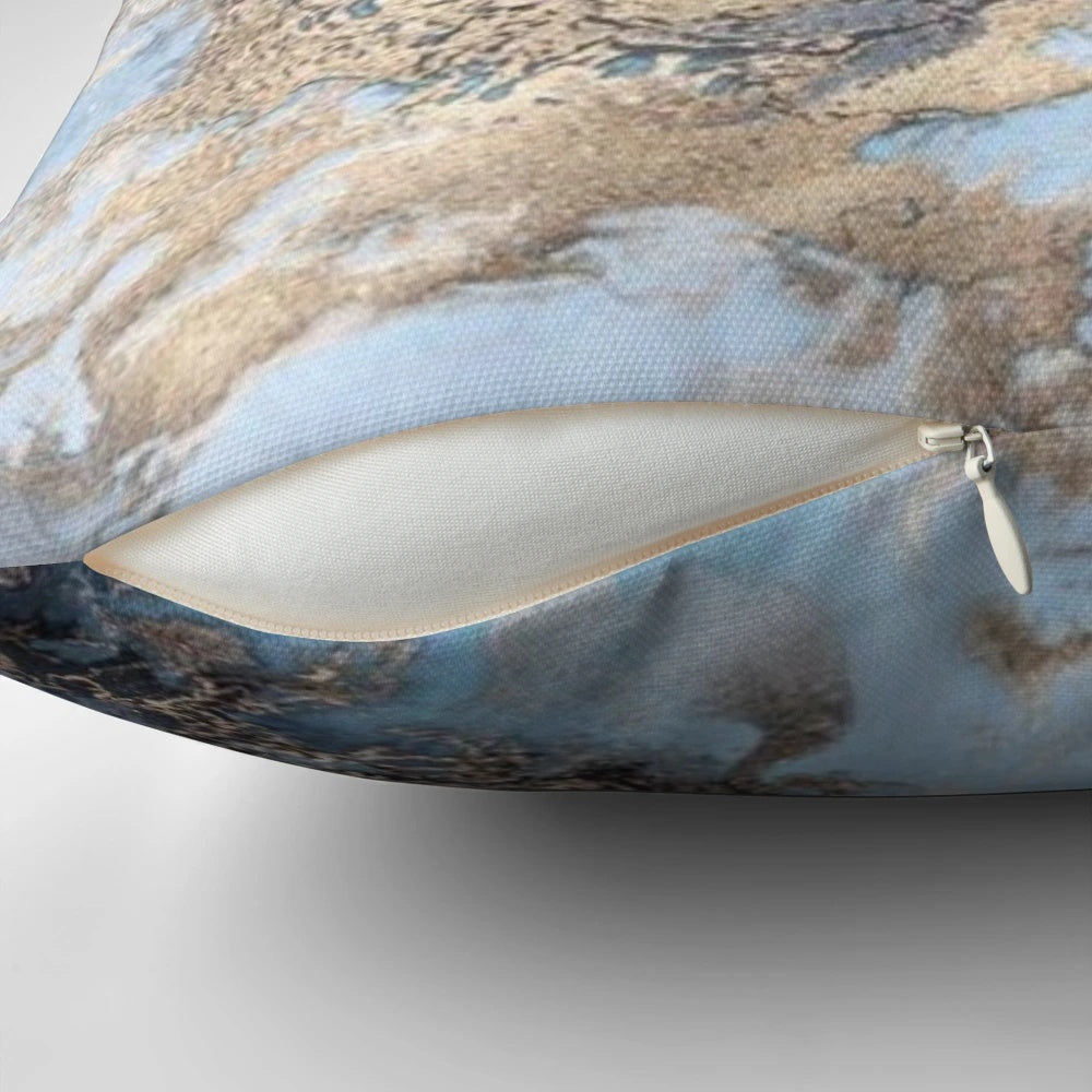 Blue and gold marble decorative pillow with a modern, chic design