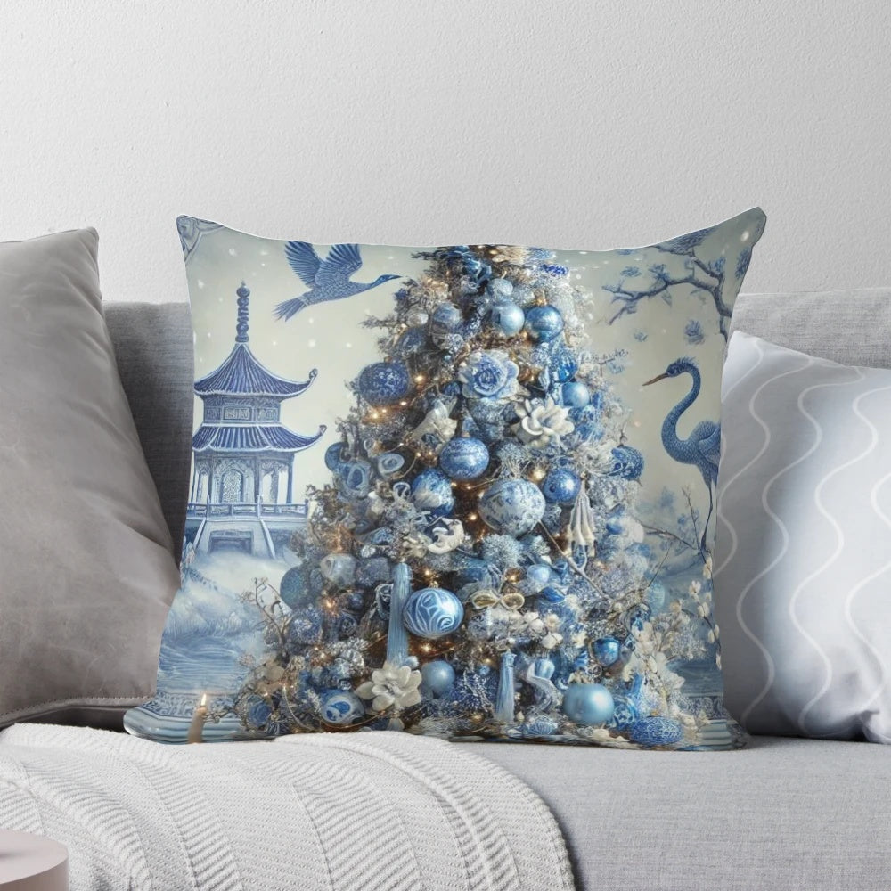 Blue and white chinoiserie-style Christmas pillow with pine branches, berries, and a decorative bow