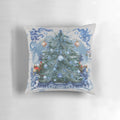 Blue and white chinoiserie-inspired Christmas tree pillow with pine branches, berries, and a bow
