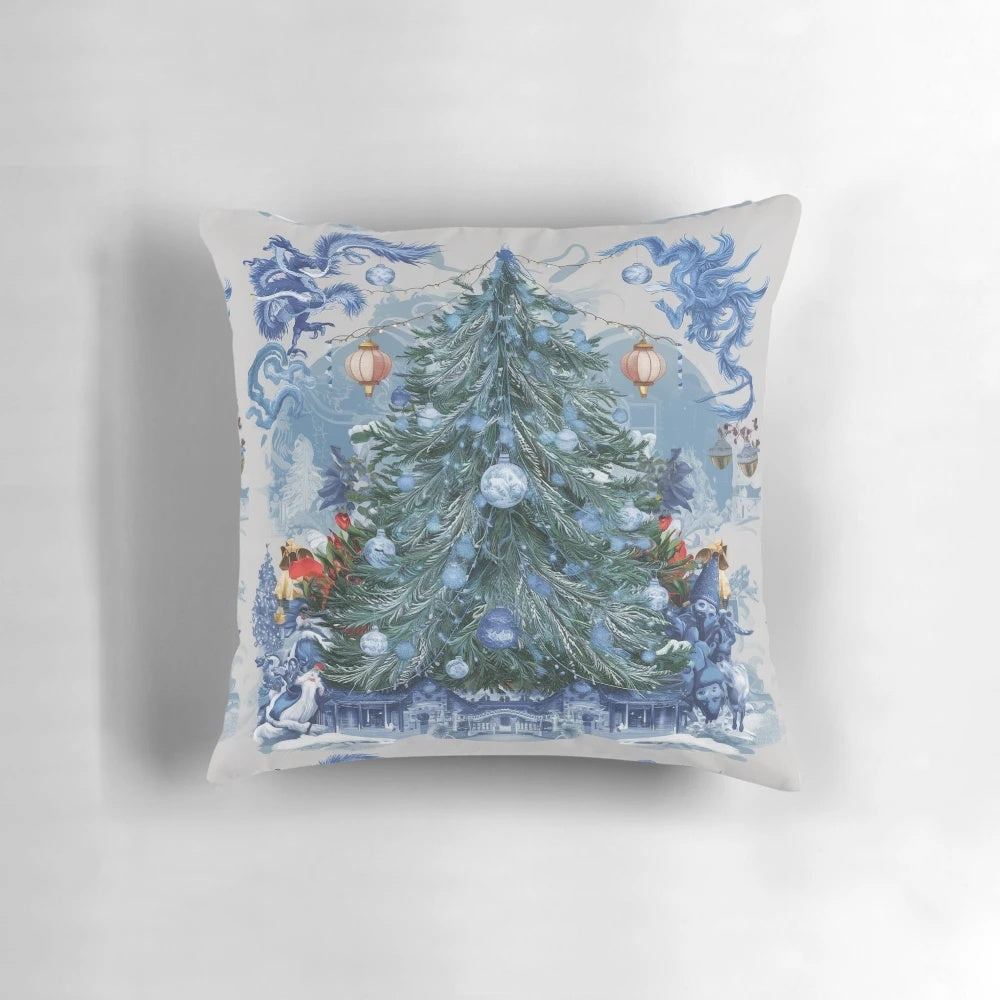 Blue and white chinoiserie-inspired Christmas tree pillow with pine branches, berries, and a bow