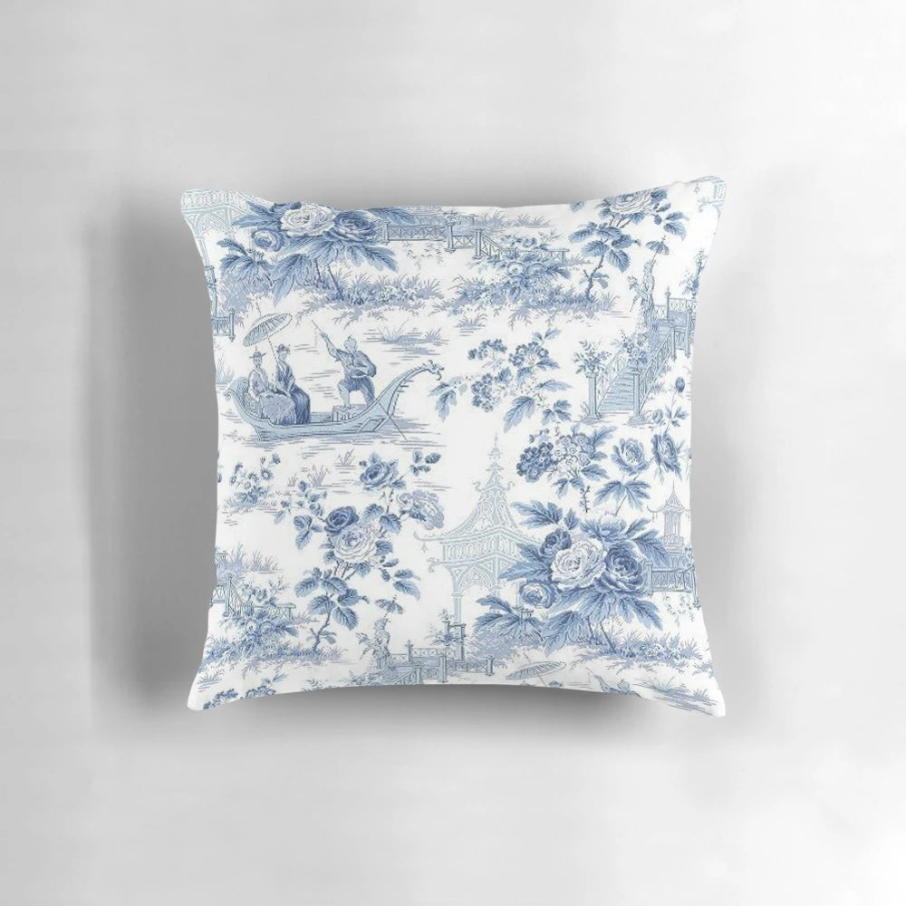Blue and white chinoiserie pattern pillow with birds and floral designs