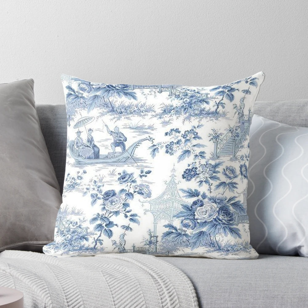 Blue and white chinoiserie pattern pillow with birds and floral designs