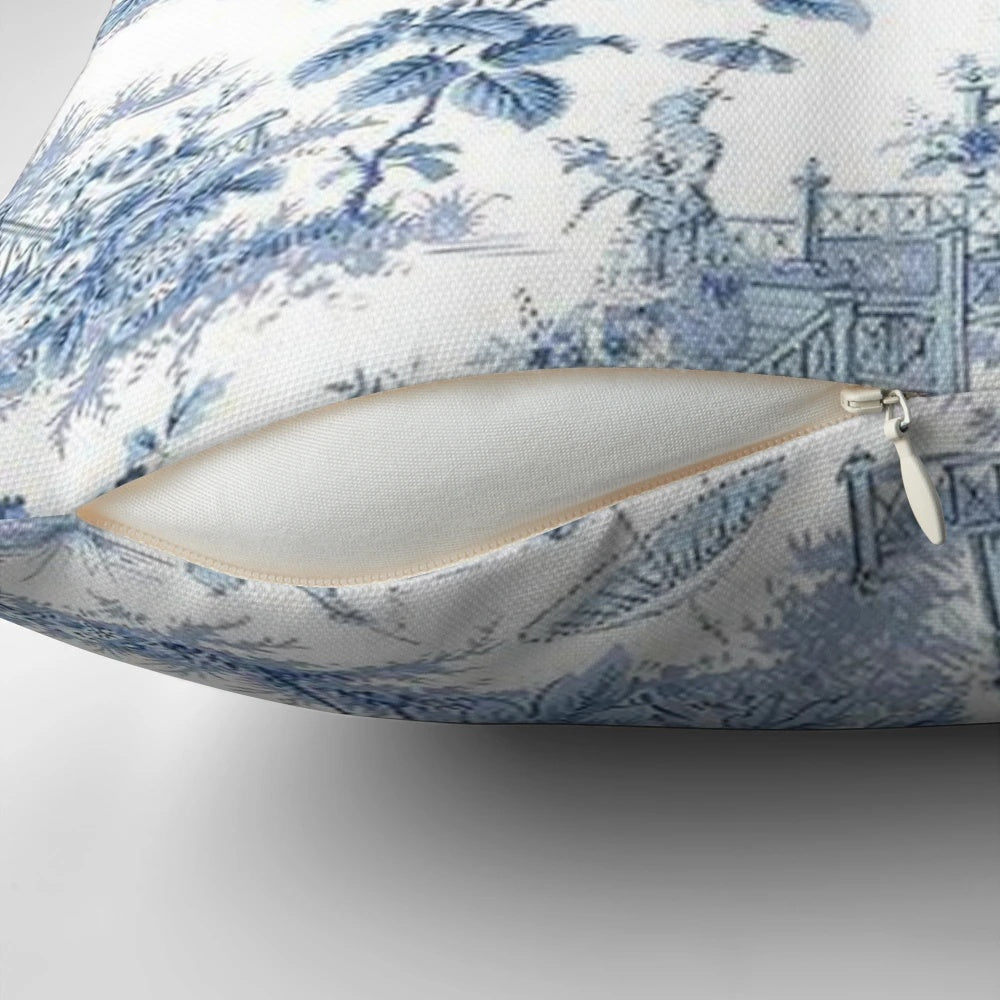 Blue and white chinoiserie pattern pillow with birds and floral designs