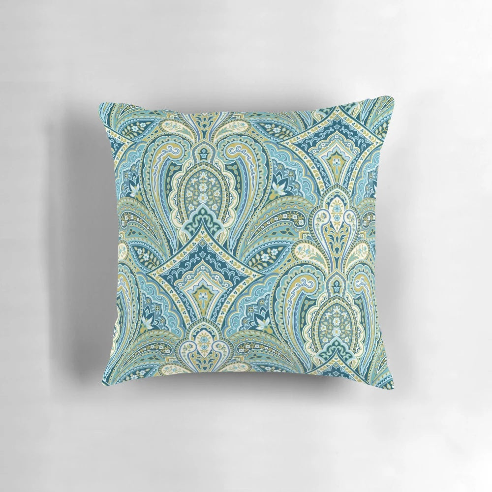 Soft, elegant blue paisley pattern pillow for a peaceful bedroom.