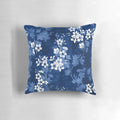Detailed image of a pillow featuring a watercolor-style pattern of sakura blossoms in shades of blue.