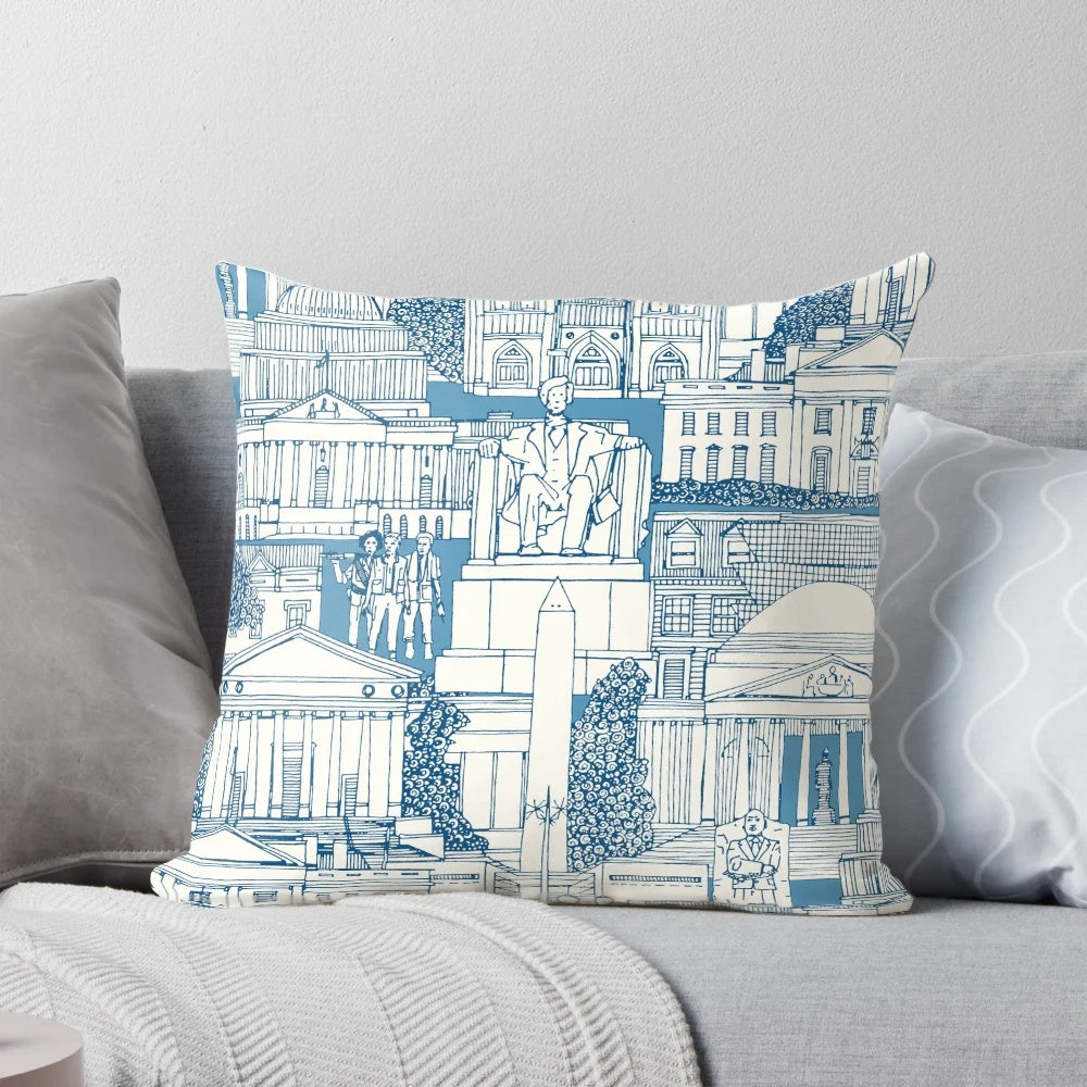 Blue and white toile pillow featuring iconic Washington DC landmarks like the Capitol Building, White House, and monuments.