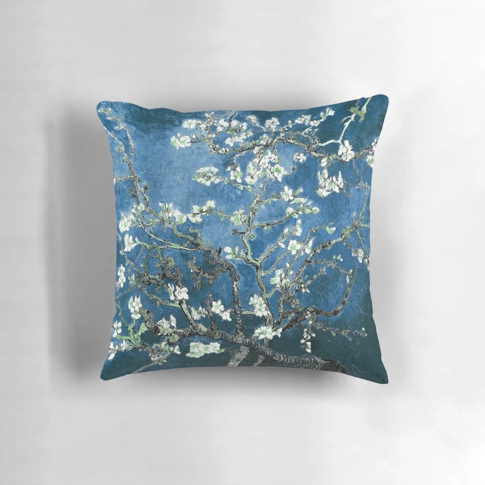 Vibrant blue pillow featuring Van Gogh's iconic Almond Blossoms painting