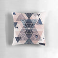 Blush pink and navy blue geometric pillow with triangles and hexagons