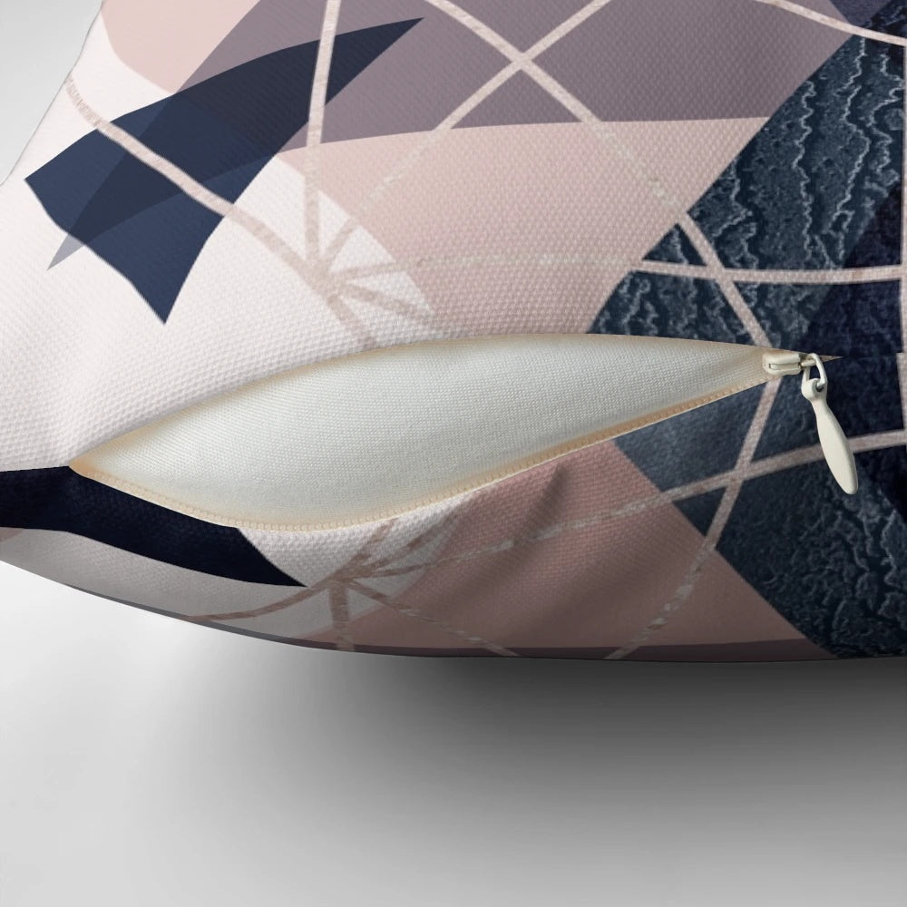 Blush pink and navy blue geometric pillow with triangles and hexagons