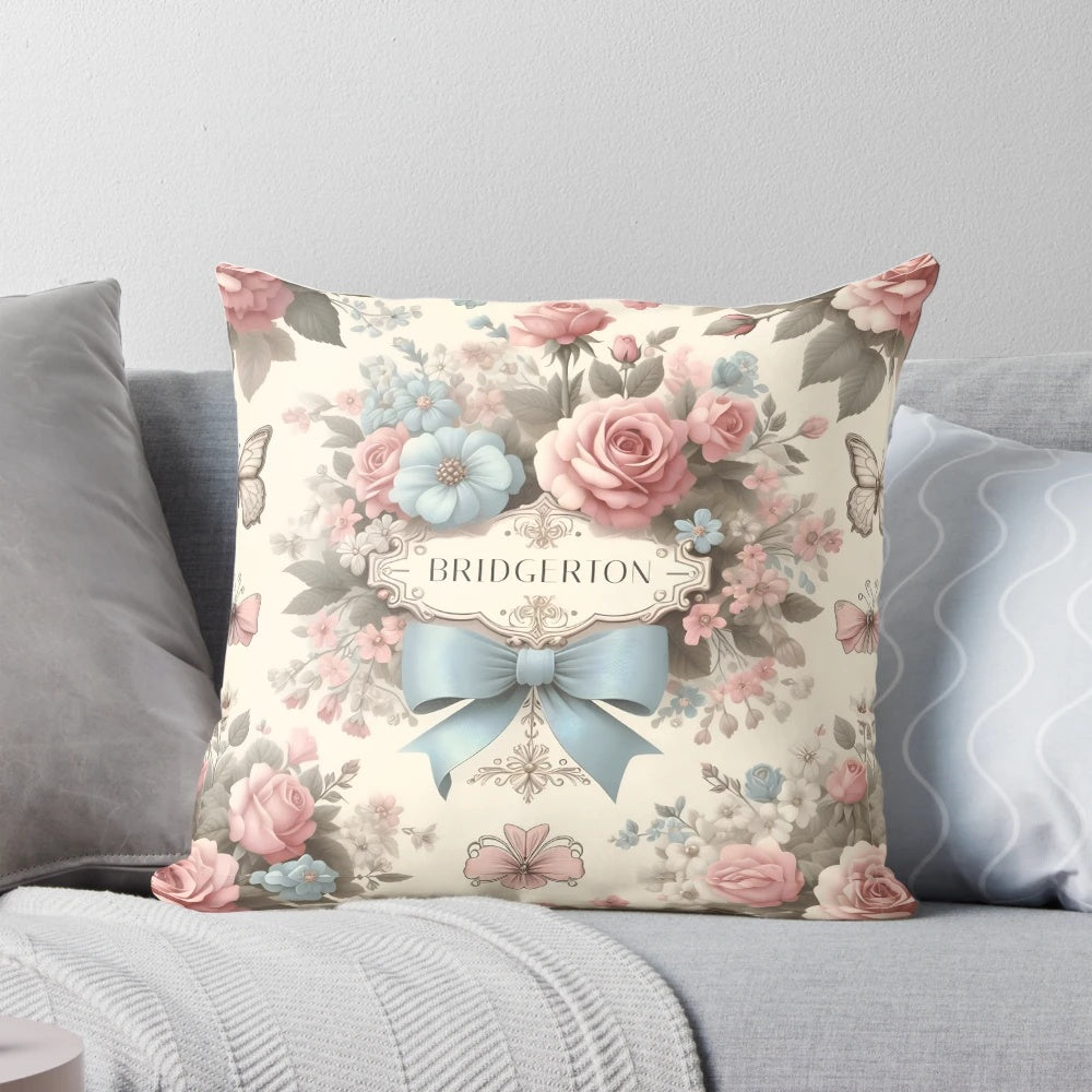 A soft, pastel-colored Bridgerton-inspired Polin pillow with delicate floral and satin bow design, perfect for adding a touch of whimsical elegance to your home.