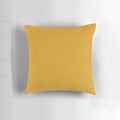 Burnt yellow, boho-inspired solid pillow with a textured design, perfect for modern and earthy home decor.