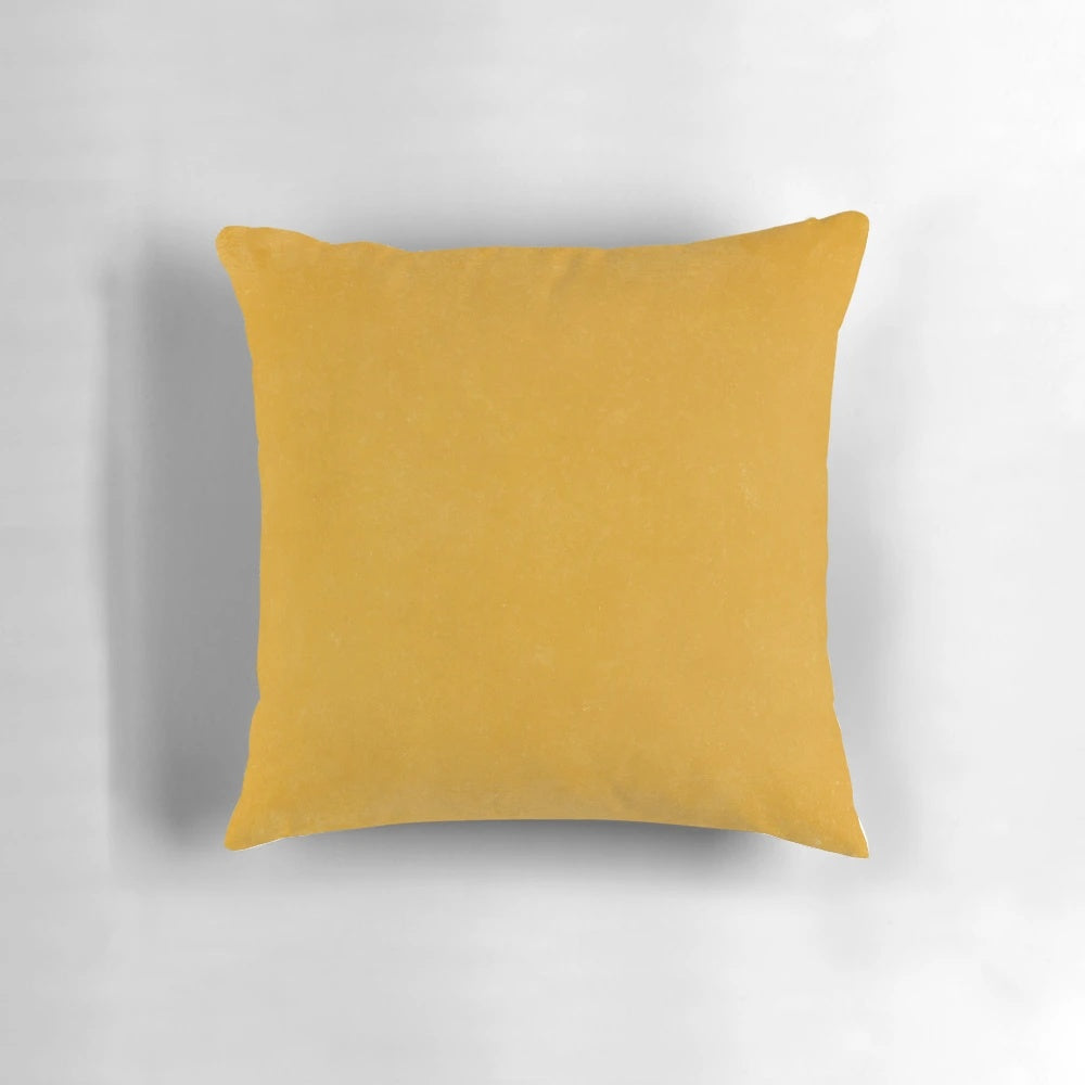 Burnt yellow, boho-inspired solid pillow with a textured design, perfect for modern and earthy home decor.