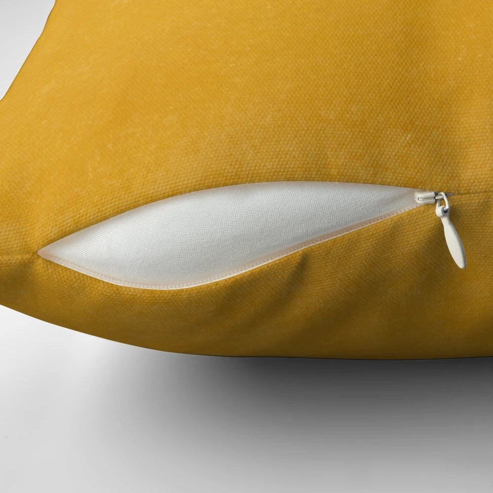 Burnt yellow, boho-inspired solid pillow with a textured design, perfect for modern and earthy home decor.