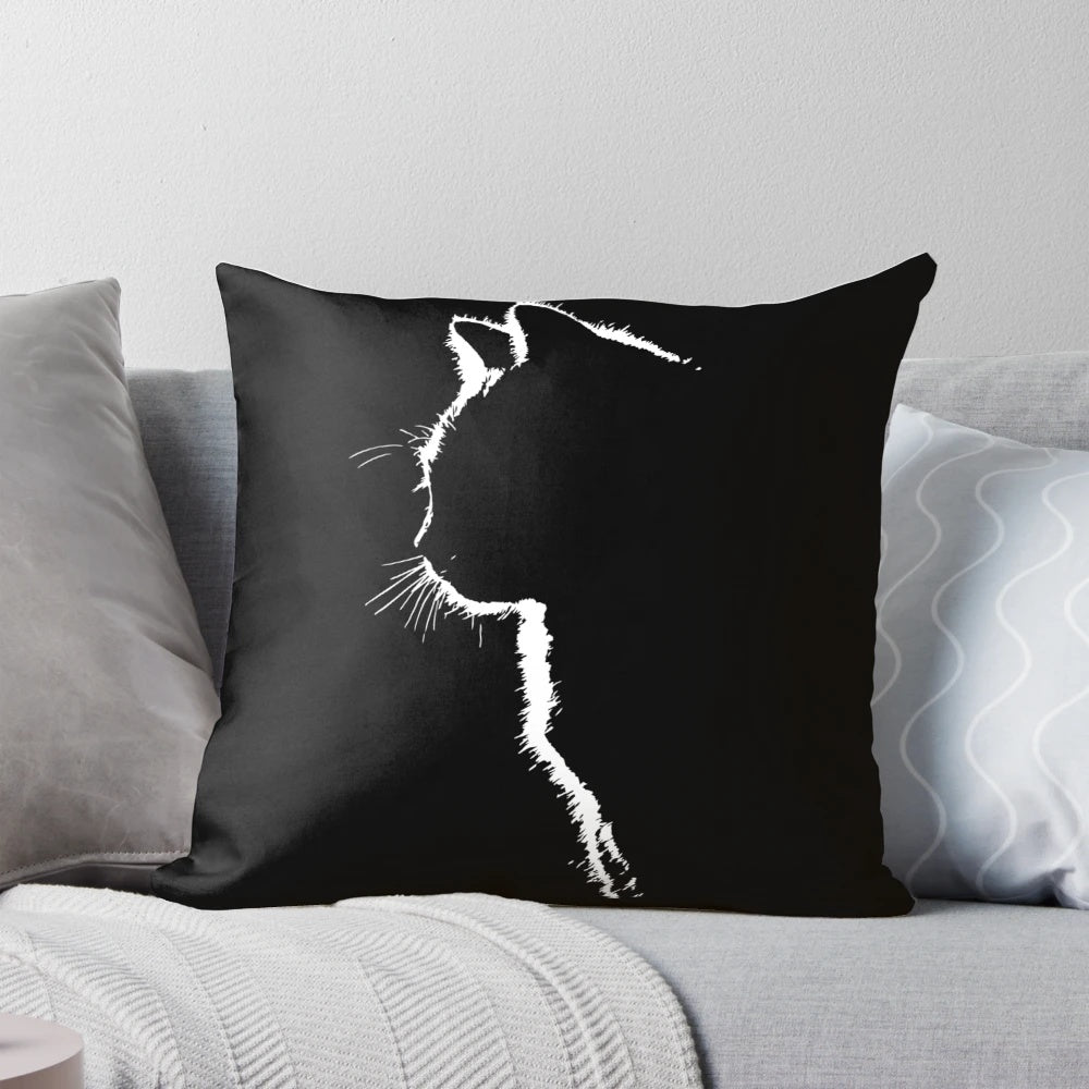 Striking black and white cat silhouette design on a plush, high-quality pillow.