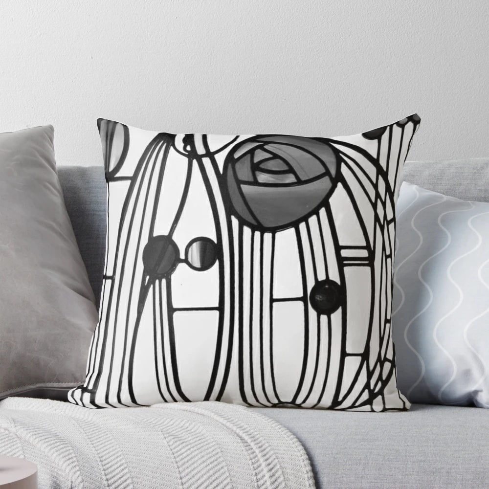 Decorative pillow featuring the iconic rose and teardrop design by renowned Scottish architect and artist Charles Rennie Mackintosh