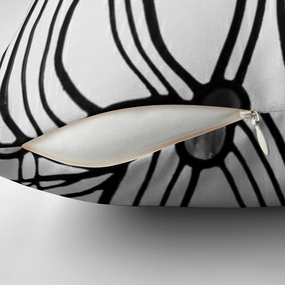 Decorative pillow featuring the iconic rose and teardrop design by renowned Scottish architect and artist Charles Rennie Mackintosh