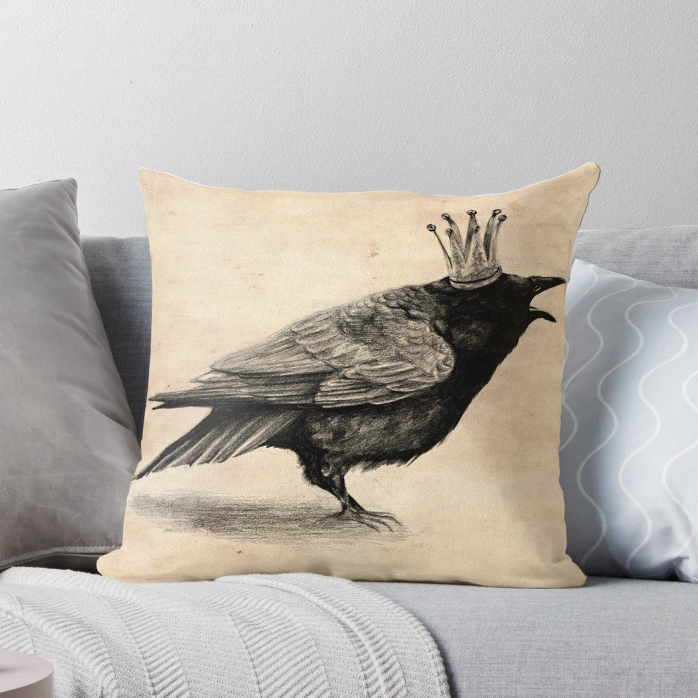 A stylish throw pillow featuring a black and white raven or crow wearing a crown, perfect for adding a touch of whimsy to your home decor.