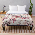 Soft and plush cherry blossom pattern blanket for a cozy spring home