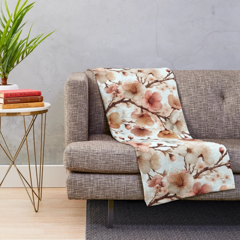Soft and cozy plush blanket with a detailed cherry blossom floral pattern