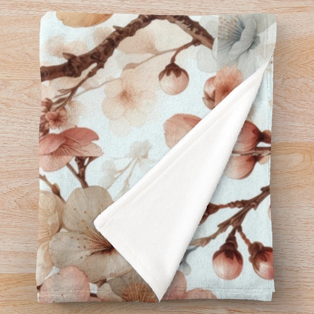 Soft and cozy plush blanket with a detailed cherry blossom floral pattern