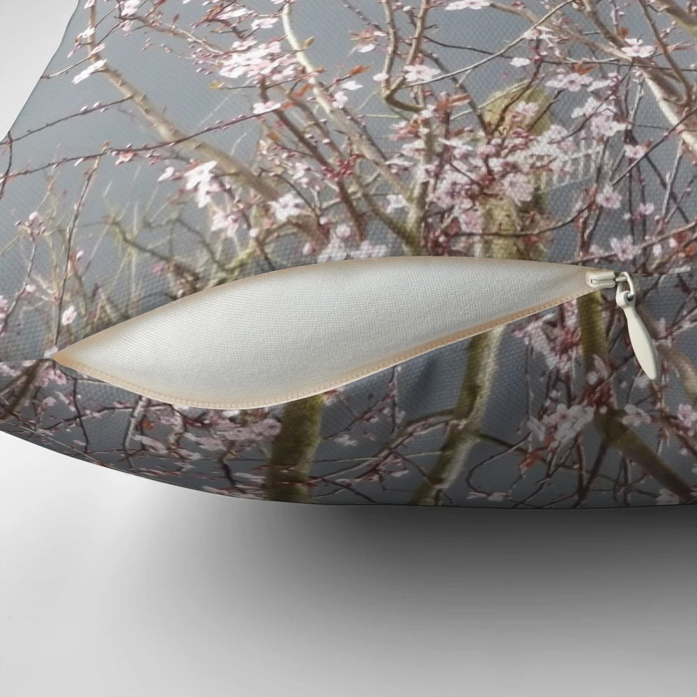 Soft, plush pillow featuring a beautiful cherry blossom floral design in shades of pink and grey.
