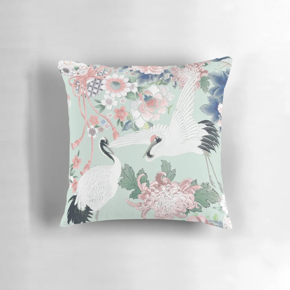 Elegant chinoiserie-inspired floral watercolor design on a soft, decorative pillow