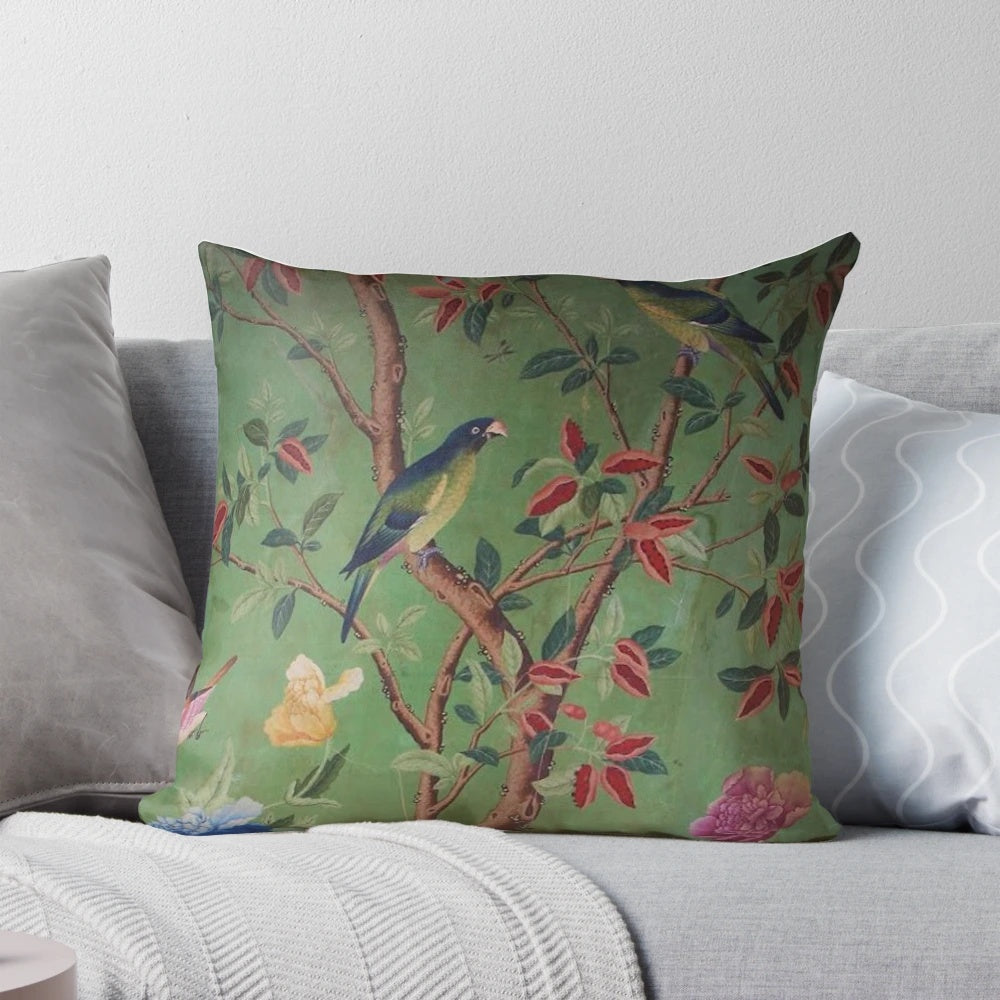 Antique-style chinoiserie-inspired decorative pillow with birds and floral motifs in blue and white colors