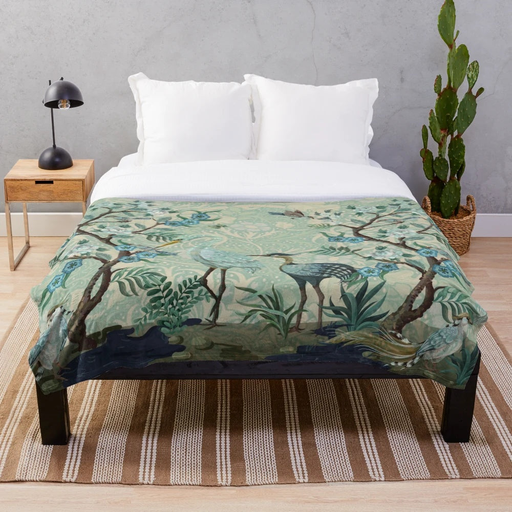 Chinoiserie-patterned plush blanket with birds and floral motifs