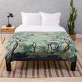 Chinoiserie-patterned plush blanket with birds and floral motifs