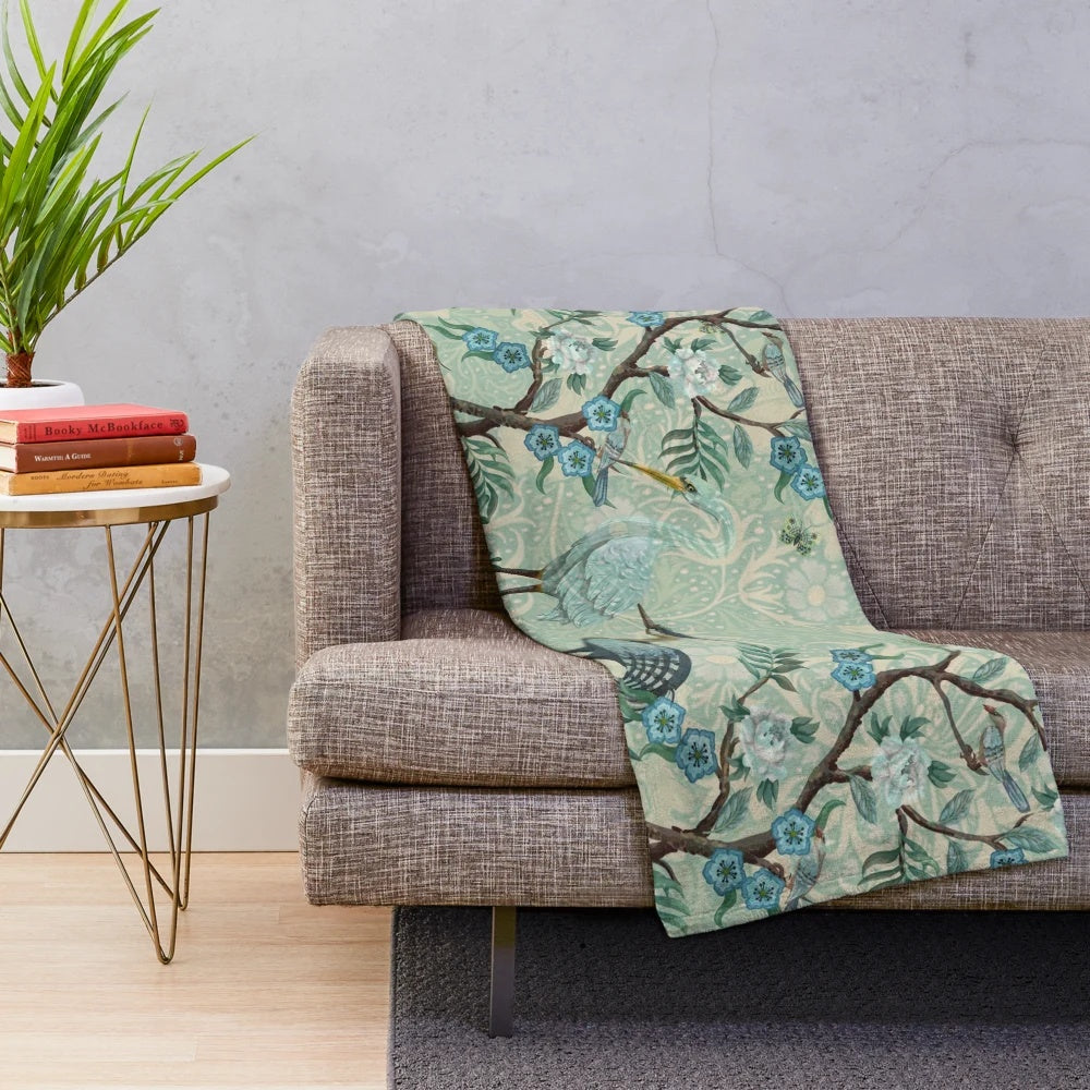 Chinoiserie-patterned plush blanket with birds and floral motifs
