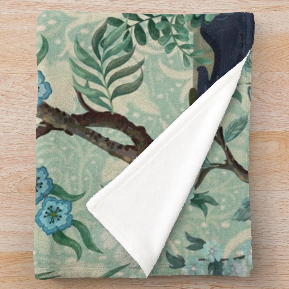 Chinoiserie-patterned plush blanket with birds and floral motifs