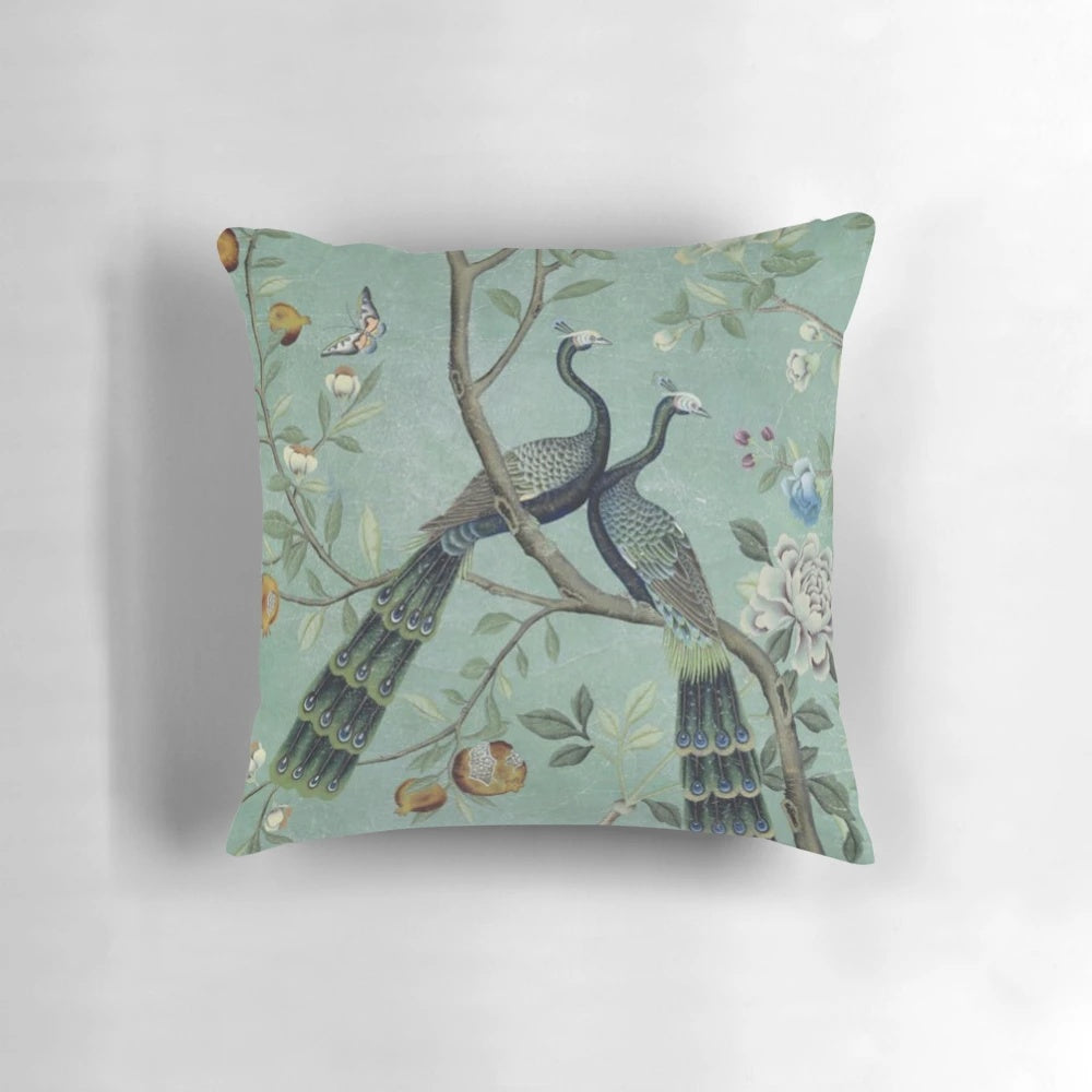 Teal and white chinoiserie-style pillow with illustrated birds, perfect for elegant and vintage-inspired home decor.