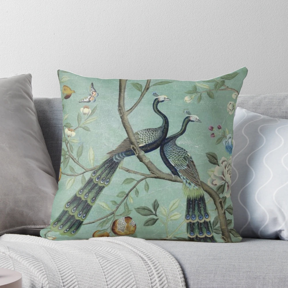 Teal and white chinoiserie-style pillow with illustrated birds, perfect for elegant and vintage-inspired home decor.