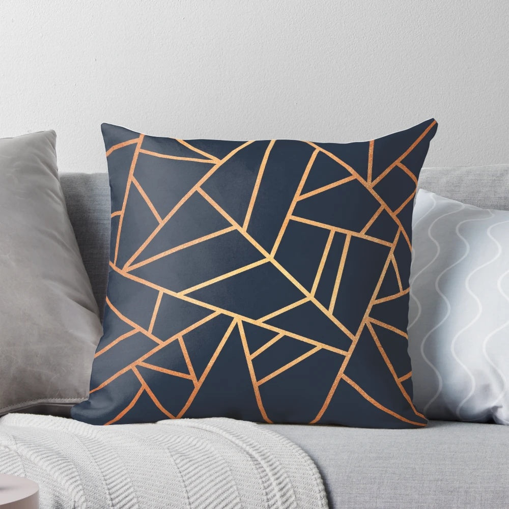 Copper and midnight navy decorative pillow with a modern geometric design