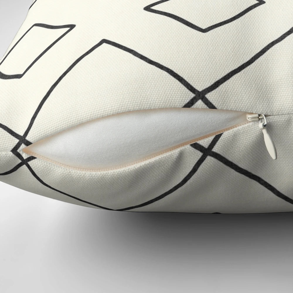 Cream-colored pillow with bohemian geometric patterns, perfect for enhancing your bathing experience.