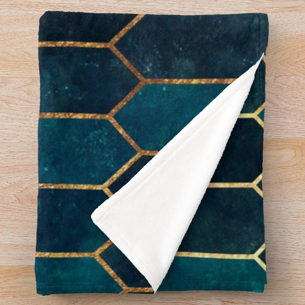 Deep teal and blue gold patterned plush blanket