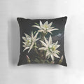 Closeup of an edelweiss flower, a delicate white blossom with soft petals, showcased on a decorative pillow.