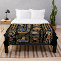Plush black blanket with golden egyptian hieroglyphs and deities