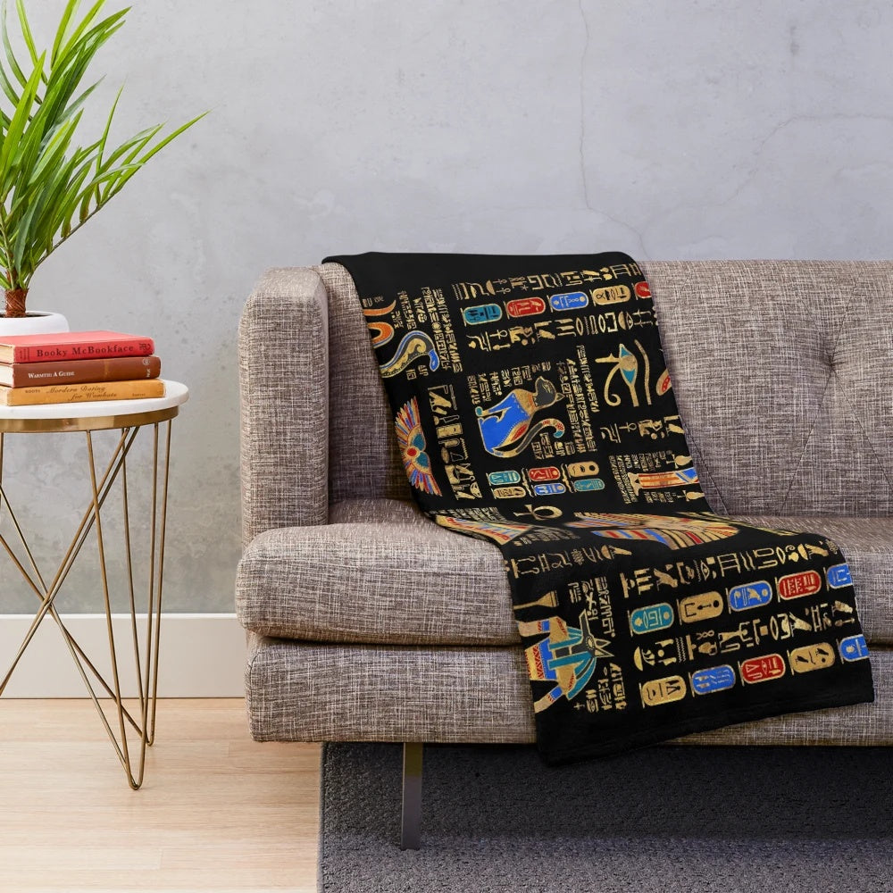 Plush black blanket with golden egyptian hieroglyphs and deities