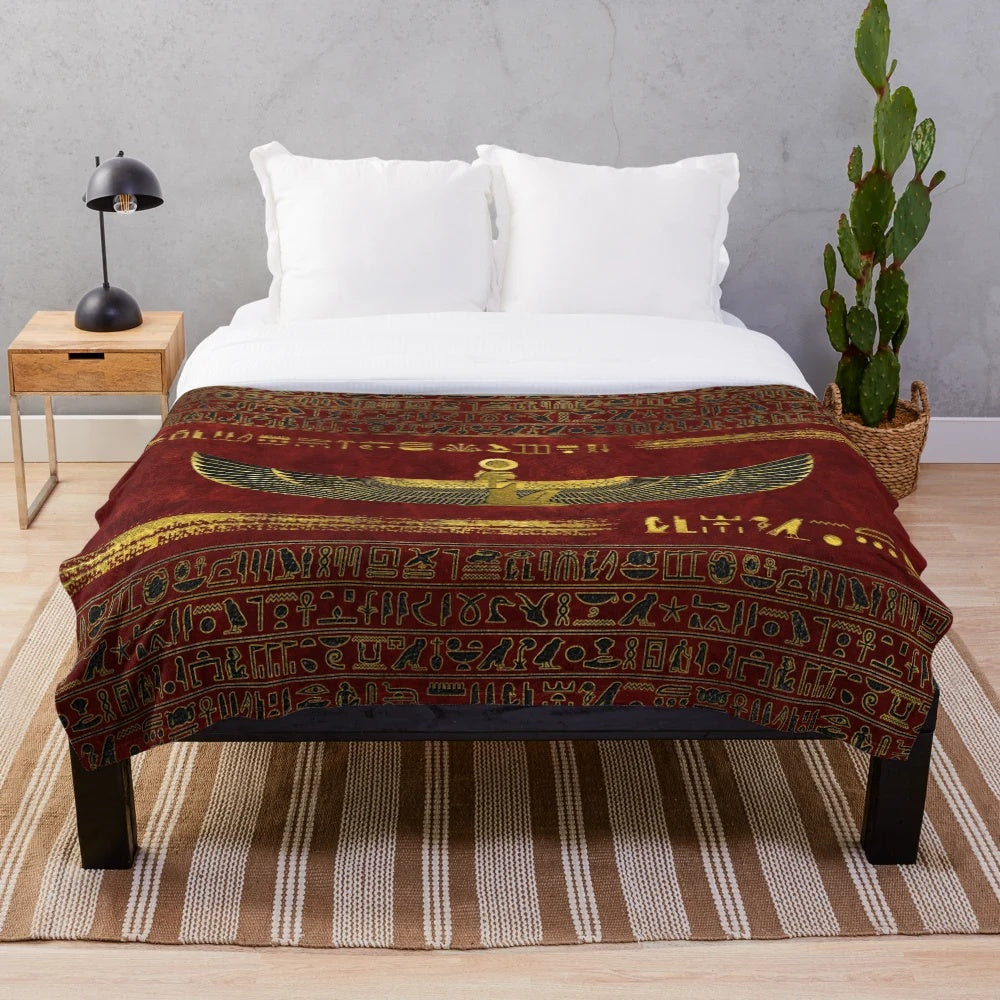 Plush blanket featuring an ancient Egyptian-inspired ornamental design