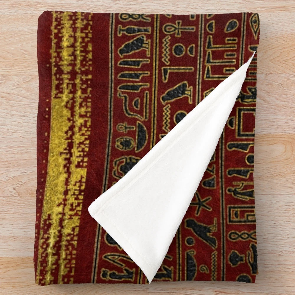 Plush blanket featuring an ancient Egyptian-inspired ornamental design