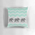 Three stylized elephants in shades of grey, teal, and turquoise on a patterned background.