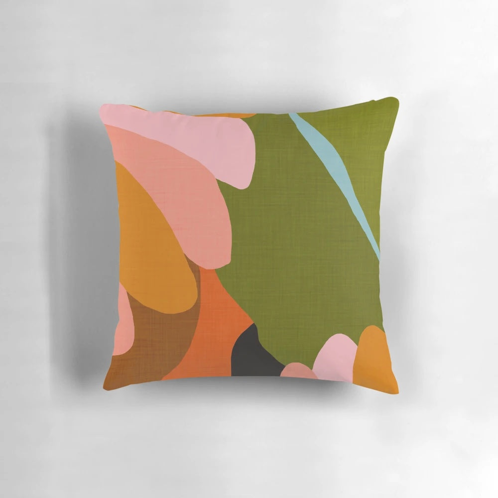 A stylish linen pillow featuring a vibrant floral and tropical leaf pattern, perfect for modern and boho-inspired home decor.
