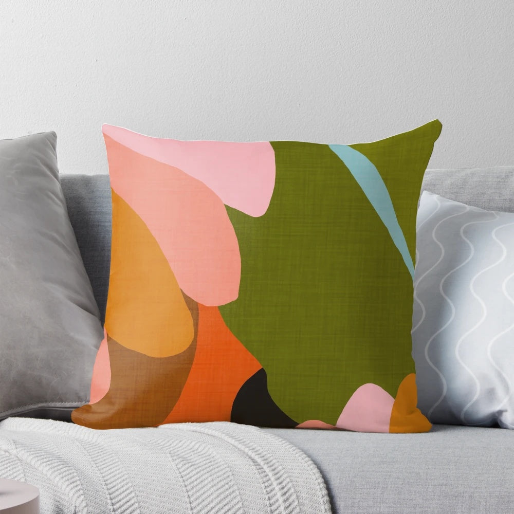 A stylish linen pillow featuring a vibrant floral and tropical leaf pattern, perfect for modern and boho-inspired home decor.