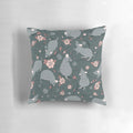 A decorative pillow featuring a floral pattern with a grey and pink color scheme, designed to appeal to pet rat owners and nature enthusiasts.